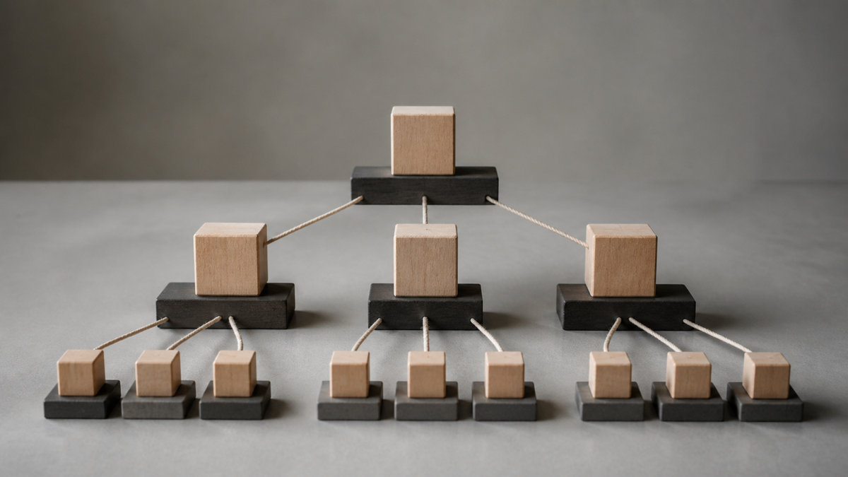 A blank organizational chart made of geometric shapes on a gray background